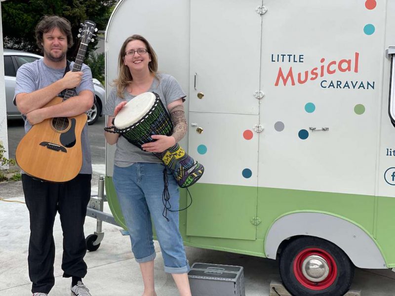 Music therapists in front of the Little Musical Caravan